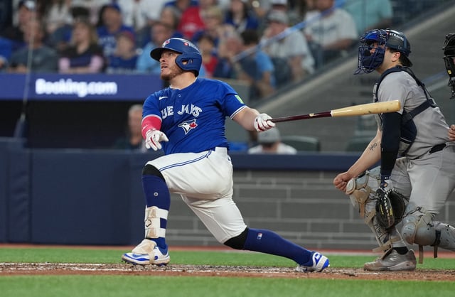 Oct 4, 2025; Toronto, Ontario, CAN; Toronto Blue Jays catcher Alejandro Kirk (30) hits a home run in the eighth inning against the New York Yankees during game one of the ALDS round for the 2025 MLB playoffs at Rogers Centre. Mandatory Credit: Nick Turchiaro-Imagn Images