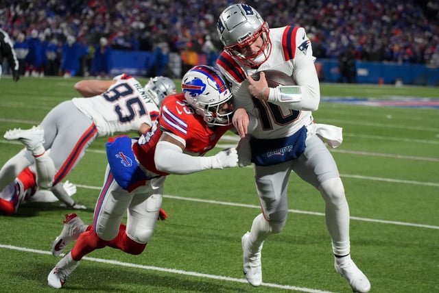 Buffalo Bills cornerback Cam Lewis (39) forces New England Patriots quarterback Drake Maye out of bounds during the first quarter of an NFL game  Sunday, Dec. 22, 2024 in Orchard Park, N.Y.. (AP Photo/Gene J. Puskar)