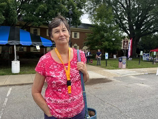 Jan Callaway, a Republican poll watcher, poses for a picture outside the early voting location in Virginia Beach, Virginia, U.S., October 2, 2025. REUTERS/Nathan Layne