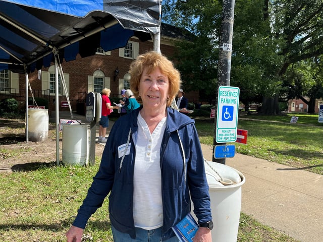Betty Snellenberg, a volunteer for the Democratic Party, poses for a picture outside the early voting location in Virginia Beach, Virginia, U.S., October 2, 2025. REUTERS/Nathan Layne