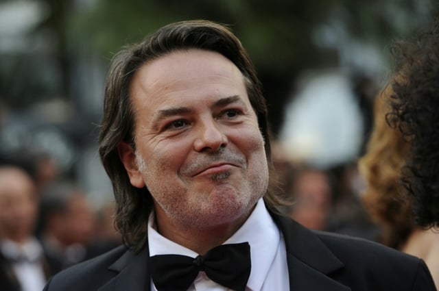 Le réalisateur Xavier Durringer sur le tapis rouge pour la projection de "La Conquête" au 64e Festival de Cannes, le 18 mai 2011