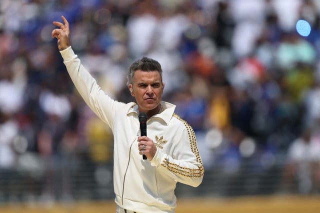 Soccer Football - FIFA Club World Cup - Final - Chelsea v Paris St Germain - MetLife Stadium, East Rutherford, New Jersey, U.S. - July 13, 2025 Robbie Williams performs before the match REUTERS/Lee Smith