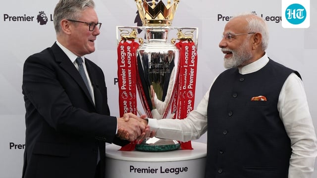 Indian PM Narendra Modi and his British PM Keir Starmer strike a pose with the Premier League football championship trophy during Modi's visit to the UK earlier this year. Starmer is scheduled to arrive in India later this week.