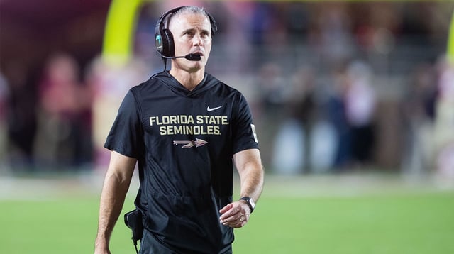 Florida State Seminoles head coach Mike Norvell walks down the field. The Miami Hurricanes lead the Florida State Seminoles 14-3 at the half on Saturday, Oct. 4, 2025.
