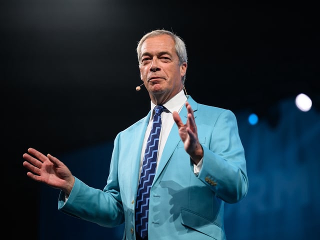 BIRMINGHAM, ENGLAND - SEPTEMBER 05: Leader of Reform UK Nigel Farage addresses delegates towards the end of day one of the Reform UK party conference at National Exhibition Centre on September 05, 2025 in Birmingham, England. Members of Reform UK gather at the NEC Birmingham for the Party's two-day conference. (Photo by Leon Neal/Getty Images)