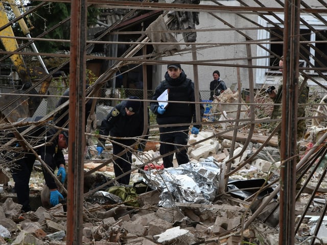 LVIV, UKRAINE - OCTOBER 5: Emergency services clear debris at the site of a private house hit by a Russian missile, following a Russian attack on the city, in Lviv, Ukraine, October 5, 2025. On the night of October 5, Russia carried out a combined shelling of Lviv with missiles and drones. It was the largest attack on the city since the start of a full-scale invasion. More than 50 missiles and about 500 drones were launched across Ukraine. Private houses, cars, and industrial facilities were destroyed in Lviv. Four people were killed, several others are in serious condition. (Photo by Olena Znak/Anadolu via Getty Images)