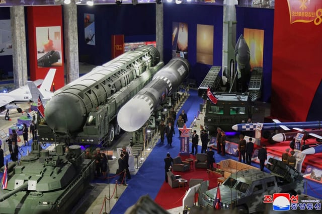In this photo provided by the North Korean government, North Korean leader Kim Jong Un, center, visits a military hardware exhibition in Pyongyang, Notrh Korea Saturday, Oct. 4, 2025. Independent journalists were not given access to cover the event depicted in this image distributed by the North Korean government.