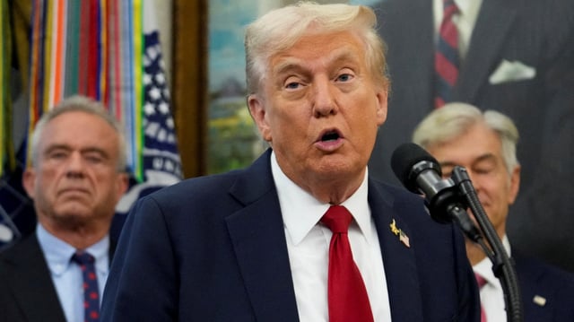 President Donald Trump joked about getting COVID after HHS Secretary Robert Kennedy Jr. sneezed on him while he was announcing a deal with Pfizer to sell drugs at lower prices on September 30, 2025.