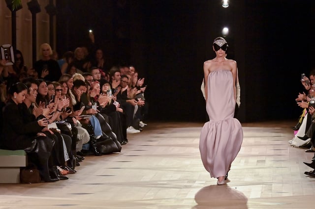 A model walks Balenciaga's Spring-Summer 2026 fashion show at Paris Fashion Week. It's the first collection for the brand by designer Pierpaolo Piccioli.