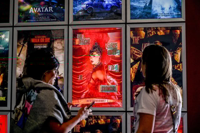 Fans take pictures in the lobby as they attend "Taylor Swift: The Official Release Party of a Showgirl" at AMC Montgomery 16 movie theater in Bethesda, Maryland, on Friday.