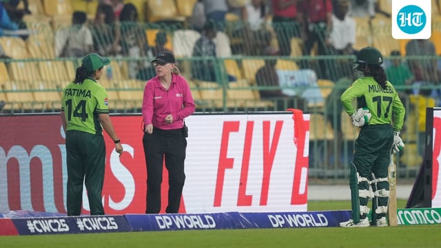 Pakistan's captain Fatima Sana, left, speaks to umpire about the dismissal of Muneeba Ali, right.