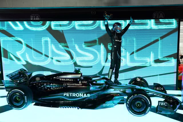 Formula One F1 - Singapore Grand Prix - Marina Bay Street Circuit, Singapore - October 5, 2025 Mercedes' George Russell celebrates after winning the Singapore Grand Prix REUTERS/Athit Perawongmetha