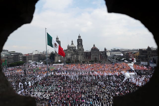 People gather at Zocalo Square to attend an event marking Mexico's President Claudia Sheinbaum's first year in office, in Mexico City, Mexico, October 5, 2025. REUTERS/Henry Romero