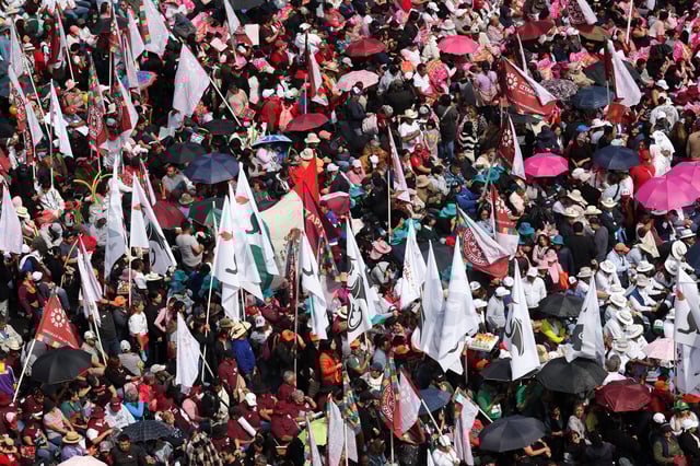 People gather at Zocalo Square to attend an event marking Mexico's President Claudia Sheinbaum's first year in office, in Mexico City, Mexico, October 5, 2025. REUTERS/Henry Romero