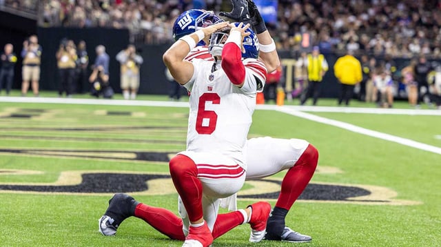 Oct 5, 2025; New Orleans, Louisiana, USA; New York Giants tight end Theo Johnson (84) and quarterback Jaxson Dart (6) react to a touchdown against New Orleans Saints during the first half at Caesars Superdome. Mandatory Credit: Stephen Lew-Imagn Images