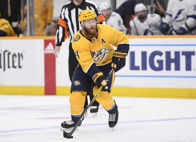 Feb 9, 2021; Nashville, Tennessee, USA; Ryan Ellis (4) skates against the Tampa Bay Lightning during the first period at Bridgestone Arena. Mandatory Credit: Steve Roberts-USA TODAY Sports/File Photo
