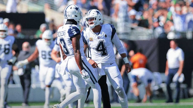 Oct 5, 2025; East Rutherford, New Jersey, USA; Dallas Cowboys quarterback Dak Prescott (4) reacts with wide receiver George Pickens (3) after throwing a touchdown pass against the New York Jets during the first half at MetLife Stadium. Mandatory Credit: Vincent Carchietta-Imagn Images