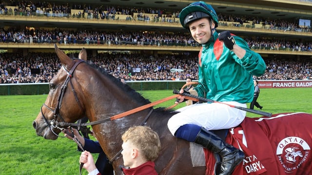 Barzalona celebrates his win on Daryz in front of the main stand at Longchamp