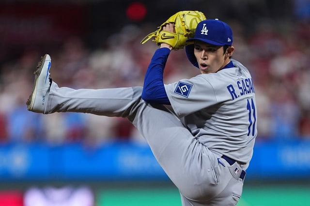 Dodgers relief pitcher Roki Sasaki throws to the plate during the ninth inning in Game 1 of baseball’s National League Division Series against the Philadelphia Phillies, Saturday, Oct. 4, 2025, in Philadelphia. (AP Photo/Matt Rourke)