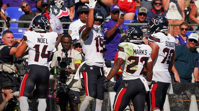Oct 5, 2025; Baltimore, Maryland, USA; Houston Texans wide receiver Xavier Hutchinson (19) celebrates a touchdown with wide receiver Jaylin Noel (14), running back Woody Marks (27) and center Juice Scruggs (70) during the second quarter at M&T Bank Stadium. Mandatory Credit: Mitch Stringer-Imagn Images