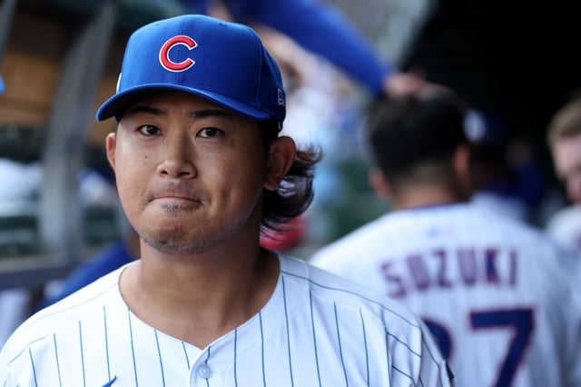 Chicago Cubs relief pitcher Shota Imanaga (18) walks through the dugout after the conclusion of the top of the third inning of Game 2 of the NL wild-card series against the San Diego Padres at Wrigley Field in Chicago on Oct. 1, 2025. (Chris Sweda/Chicago Tribune)