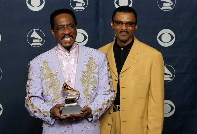 Ike Turner, left, and Ike Turner Jr. pose with the trophy for best traditional blues album for "Risin' With The Blues" at the 49th annual Grammy Awards at the Staples Center in Los Angeles on Feb. 11, 2007.