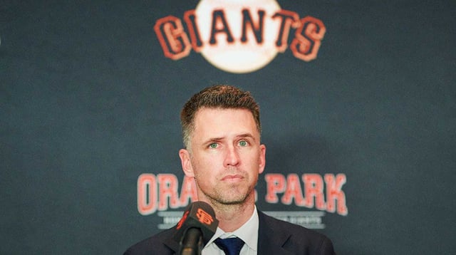 Dec 12, 2024; San Francisco, CA, USA; San Francisco Giants president of baseball operations Buster Posey listens during the introductory press conference for shortstop Willy Adames (not pictured) at Oracle Park. Mandatory Credit: Robert Edwards-Imagn Images