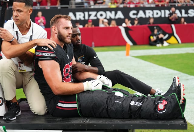 Oct 5, 2025; Glendale, Arizona, USA; Arizona Cardinals tight end Tip Reiman (87) is taken off the field on a cart after being injured against the Tennessee Titans during the third quarter at State Farm Stadium. Mandatory Credit: Joe Camporeale-Imagn Images