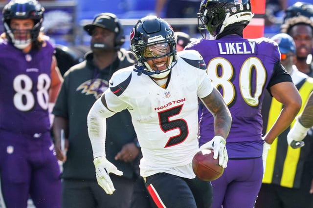 Texans safety Jalen Pitre (5) celebrates after one of his two interceptions. It was part of Houston's most complete performance of the season in a 44-10 drubbing of Baltimore.