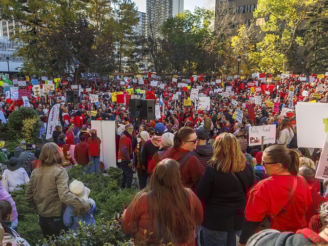  Bright red shirts at a rally in support of public education for World Teachers’ Day at McDougall Centre in Calgary on Sunday, Oct. 5, 2025.