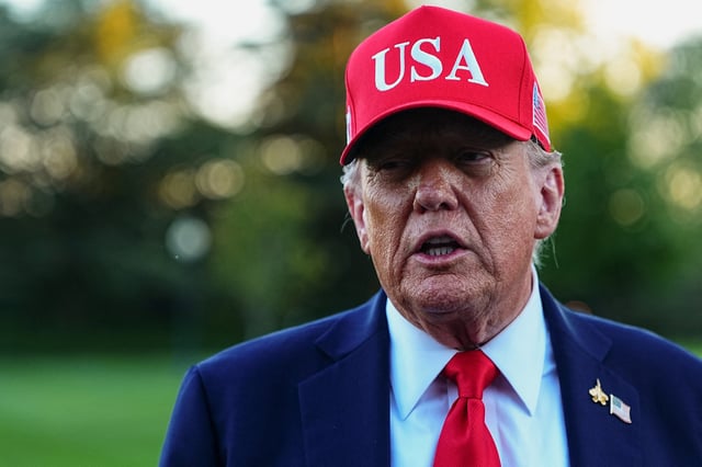 U.S. President Donald Trump speaks to members of the media as he arrives at the White House in Washington, D.C., U.S., October 5, 2025. REUTERS/Aaron Schwartz