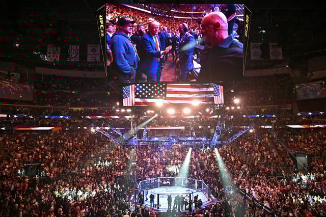 US President Donald Trump (L), UFC CEO Dana White (C) and US former professional boxer Mike Tyson (R) attend a UFC 316 event, headlined by a rematch between Georgian mixed martial artist Merab Dvalishvili and US mixed martial artist Sean O'Malley at the Prudential Center in Newark, New Jersey on June 7, 2025.