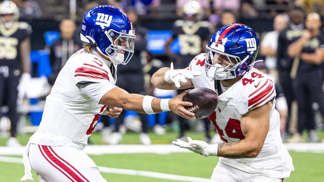 New York Giants quarterback Jaxson Dart (6) hands off to running back Cam Skattebo (44) during the first half at Caesars Superdome. Mandatory Credit: Stephen Lew-Imagn Images
