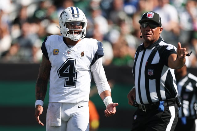 EAST RUTHERFORD, NEW JERSEY - OCTOBER 05: Dak Prescott #4 of the Dallas Cowboys talks with an official during the first quarter against the New York Jets in the game at MetLife Stadium on October 05, 2025 in East Rutherford, New Jersey. (Photo by Ishika Samant/Getty Images)
