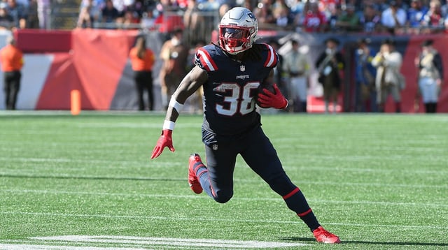 Sep 28, 2025; Foxborough, Massachusetts, USA; New England Patriots running back Rhamondre Stevenson (38) runs the ball during the second half against the Carolina Panthers at Gillette Stadium. Mandatory Credit: Bob DeChiara-Imagn Images