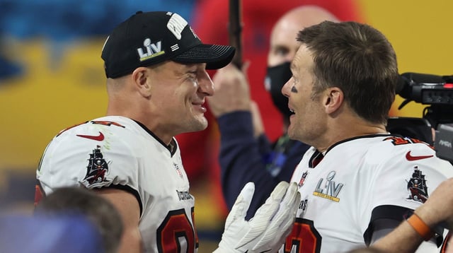 Feb 7, 2021; Tampa, FL, USA; Tampa Bay Buccaneers quarterback Tom Brady (12) and tight end Rob Gronkowski (87) celebrate after defeating the Kansas City Chiefs in Super Bowl LV at Raymond James Stadium. Mandatory Credit: Matthew Emmons-Imagn Images