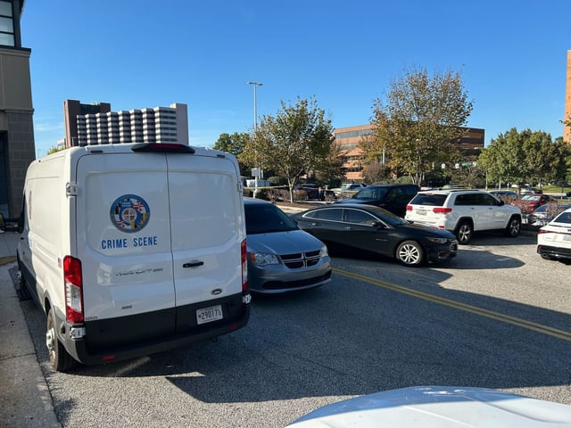 Police investigate the scene of a stabbing in the parking lot of Towson Town Center on Saturday morning. One person was taken to the hospital in critical condition, according to Baltimore County Police. (Mat Schumer/Staff)