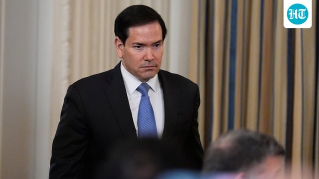 Marco Rubio arrives during a news conference in the State Dining Room of the White House.