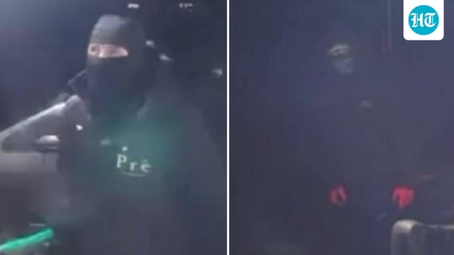 Police have released images of two masked men.