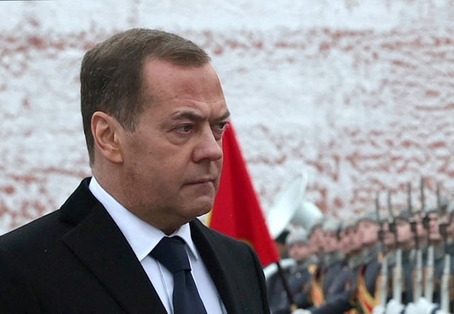 Russia's Deputy head of the Security Council Dmitry Medvedev takes part in a wreath laying ceremony marking Defender of the Fatherland Day at the Tomb of the Unknown Soldier by the Kremlin Wall in Moscow, Russia, February 23, 2024. Sputnik/Yekaterina Shtukina/Pool via REUTERS
