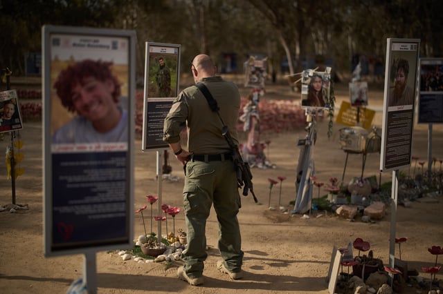 An Israeli soldier visits the site where revellers were killed and kidnapped on Oct. 7, 2023, cross-border attack by Hamas militants at the Nova music festival near the Kibbutz Reim, southern Israel, Monday, Oct. 6, 2025. (AP Photo/Leo Correa)