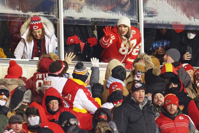 Taylor Swift celebrates with fans during the AFC Wild Card Playoffs between the Miami Dolphins and the Kansas City Chiefs on January 13, 2024 in Kansas City, MO.