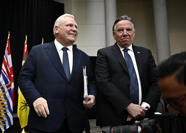 Premier of Ontario Doug Ford and Premier of Quebec Francois Legault make their way to the table for a first ministers meeting in Ottawa, on Wednesday, Jan. 15, 2025. THE CANADIAN PRESS/Justin Tang
