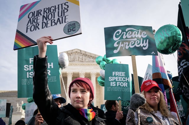 In this December 2022 photo, people stand in front of the U.S. Supreme Court demonstrating over the case of a Colorado company that refused to create websites for same-sex weddings despite a state anti-discrimination law. Colorado and LGBTQ rights will again go before the high court on Tuesday, Oct. 7, 2025, in oral arguments about the legality of conversion therapy for minors, a controversial treatment first outlawed by California.