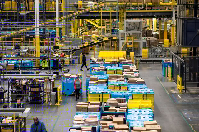 A worker moves products during Cyber Monday at Amazon's fulfillment center in Robbinsville, New Jersey, U.S., December 2, 2024. REUTERS/Eduardo Munoz
