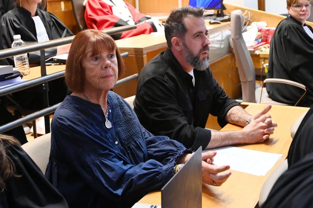 French woman Gisele Pelicot, the victim of a mass rape orchestrated by her then-husband Dominique Pelicot at their home in the southern French town of Mazan, and his son Florian are seen in the courtroom before the start of the appeal hearing filed by Husamettin D., one of the 51 people convicted in her rape trial, at the courthouse in Nimes, France, October 6, 2025. REUTERS/Alexandre Dimou