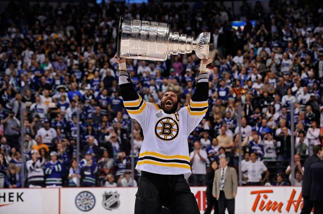 Boston Bruins defenseman Zdeno Chara holds the Stanley Cup after the Bruins defeated the Canucks in the third period of Game 7 of the Stanley Cup Finals at the Rogers Arena on Wednesday, June 15, 2011.  (Staff photo by Christopher Evans)