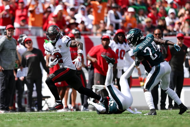 TAMPA, FLORIDA - SEPTEMBER 28: Emeka Egbuka #2 of the Tampa Bay Buccaneers catches a pass before scoring a touchdown during the fourth quarter of an NFL football game against the Philadelphia Eagles at Raymond James Stadium on September 28, 2025 in Tampa, Florida. (Photo by Kevin Sabitus/Getty Images)