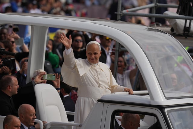 Pope Leo XIV waves from his popemobile at the end of a Mass for the Jubilee of Migrants and Missionaries in St. Peter's Square at the Vatican, Sunday, Oct. 5, 2025. (AP Photo/Alessandra Tarantino)