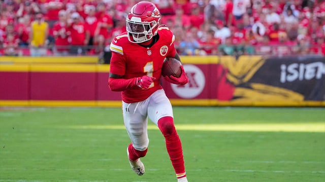 Sep 28, 2025; Kansas City, Missouri, USA; Kansas City Chiefs wide receiver Xavier Worthy (1) runs the ball against the Baltimore Ravens during the game at GEHA Field at Arrowhead Stadium. Mandatory Credit: Denny Medley-Imagn Images